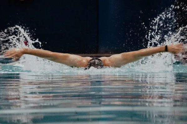 butterfly stroke swimmer underwater